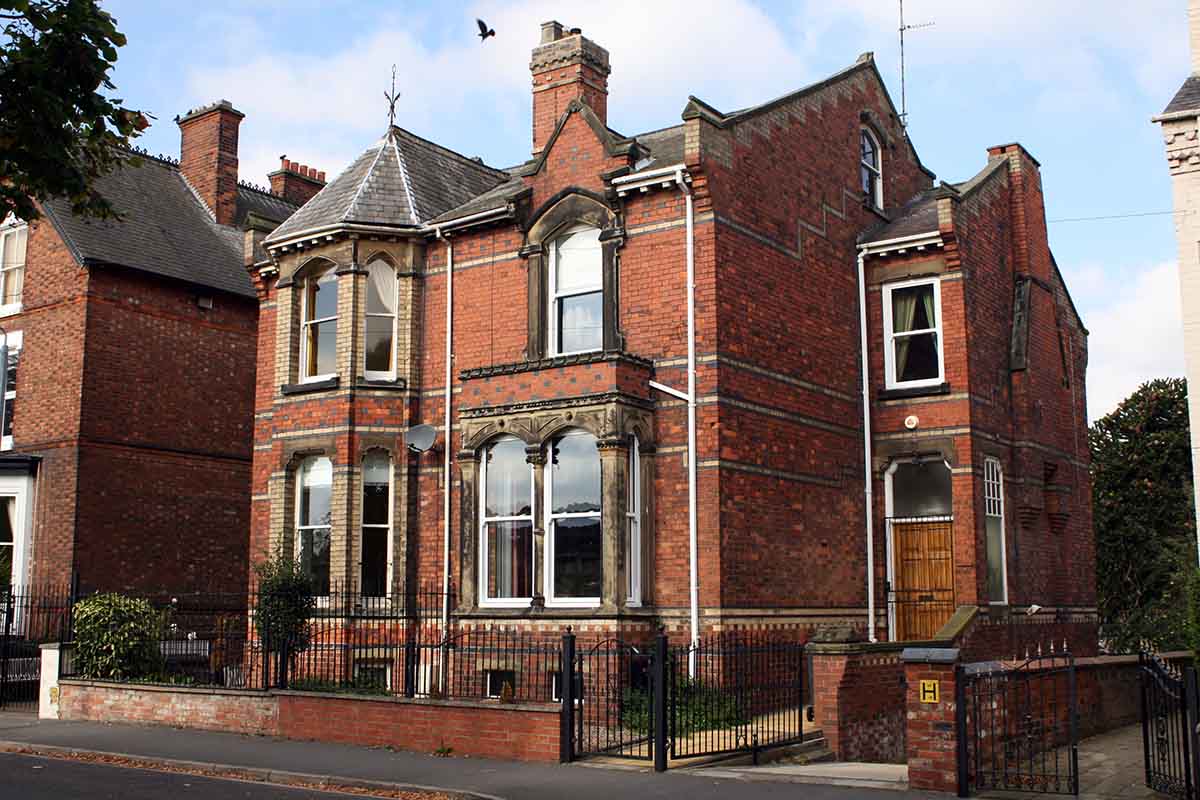 Photo of a large brick family home for sale in Lincoln.